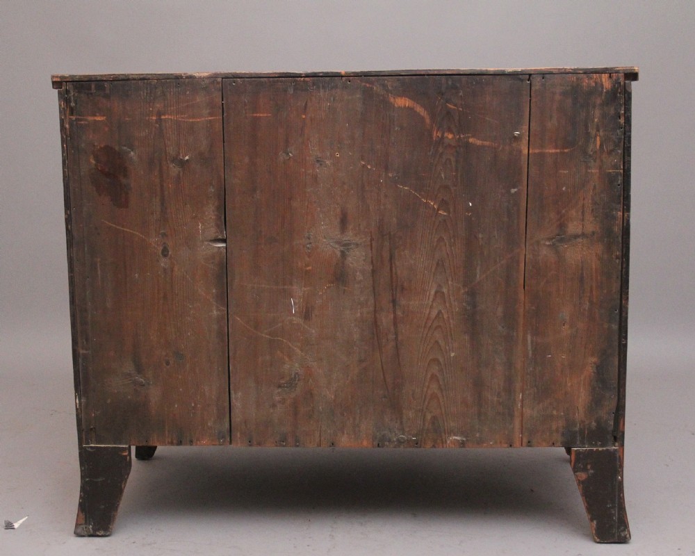 A nineteenth-century mahogany bowfront chest of drawers featuring four graduated drawers with oval brass handles and splayed feet. View VIII