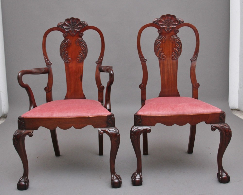 Set of eight 19th-century carved mahogany dining chairs featuring cabriole legs with ball and claw feet and red upholstered seats. View III