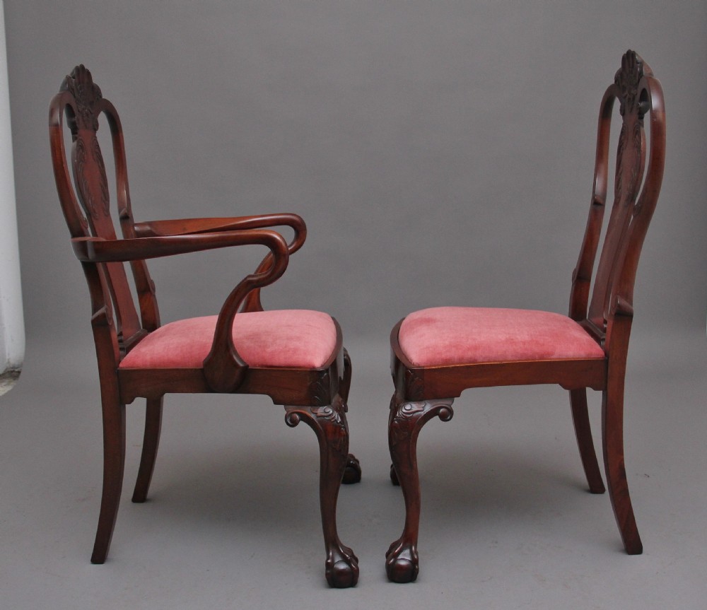 Set of eight 19th-century carved mahogany dining chairs featuring cabriole legs with ball and claw feet and red upholstered seats. View IV