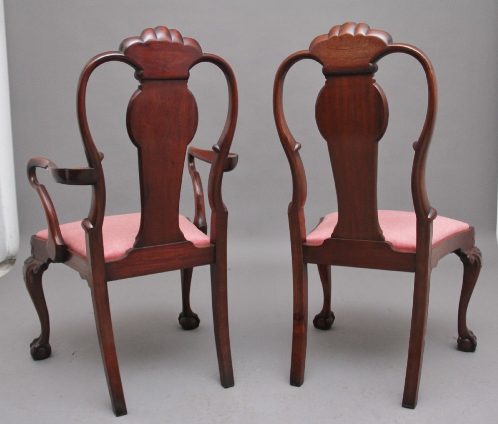 Set of eight 19th-century carved mahogany dining chairs featuring cabriole legs with ball and claw feet and red upholstered seats. View V