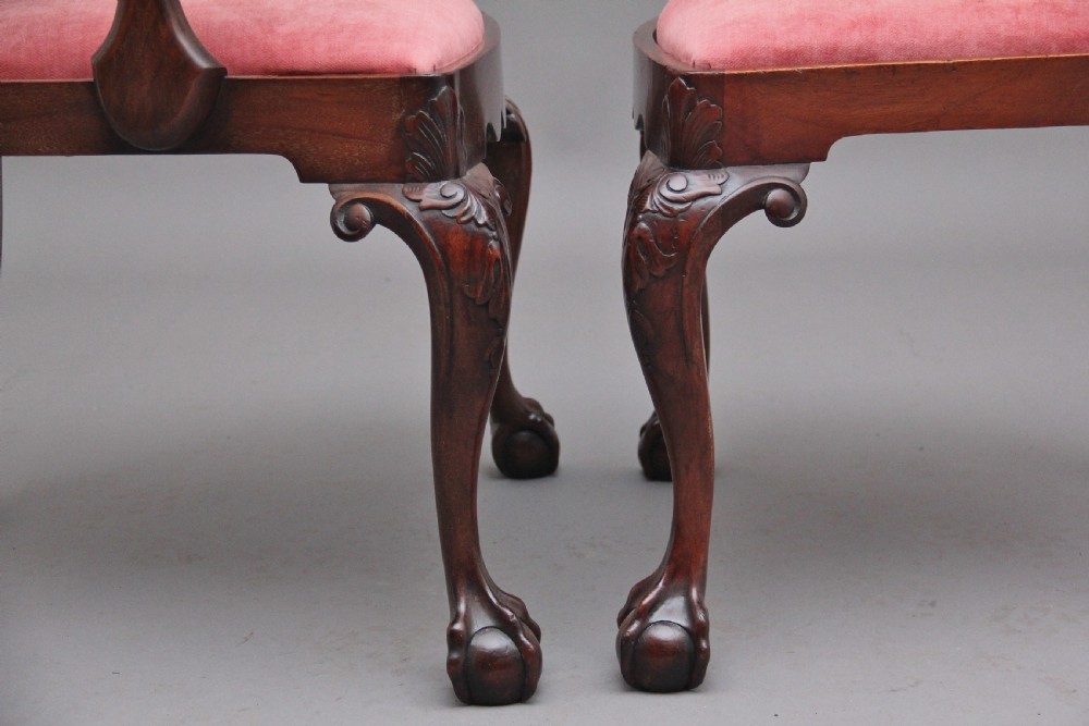 Set of eight 19th-century carved mahogany dining chairs featuring cabriole legs with ball and claw feet and red upholstered seats. View VI