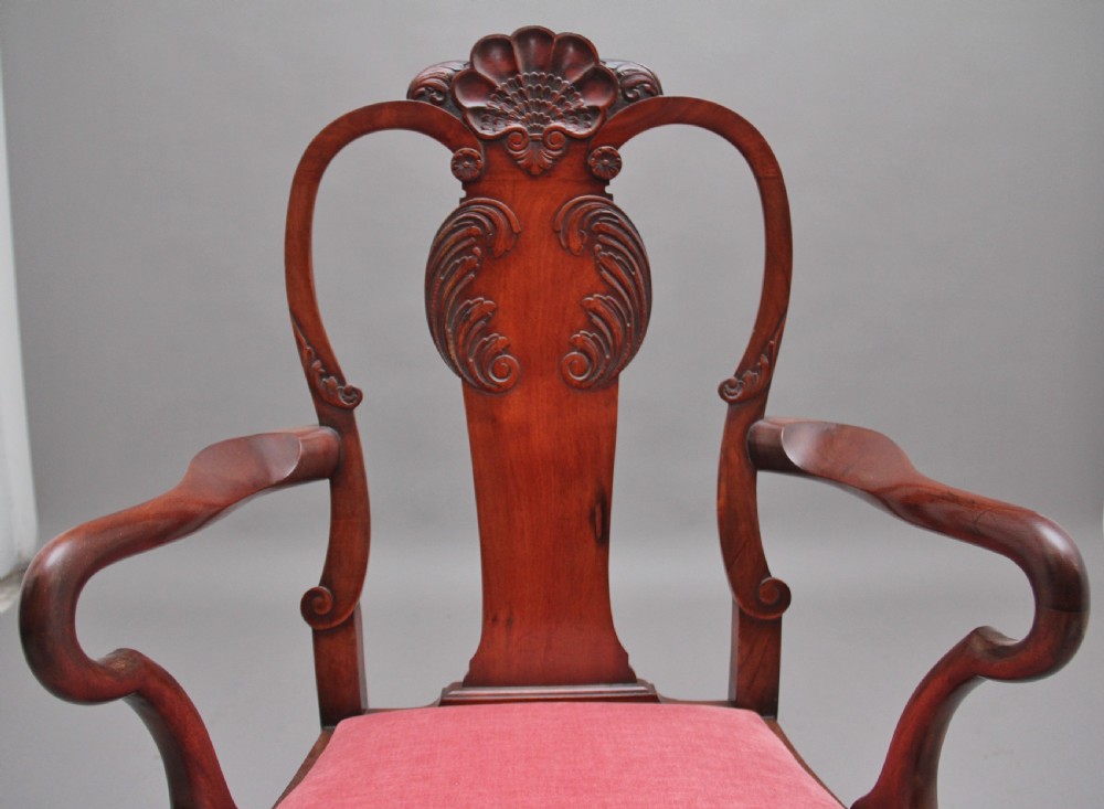 Set of eight 19th-century carved mahogany dining chairs featuring cabriole legs with ball and claw feet and red upholstered seats. View VIII
