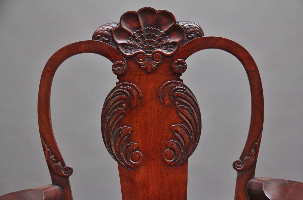 Set of eight 19th-century carved mahogany dining chairs featuring cabriole legs with ball and claw feet and red upholstered seats. View IX