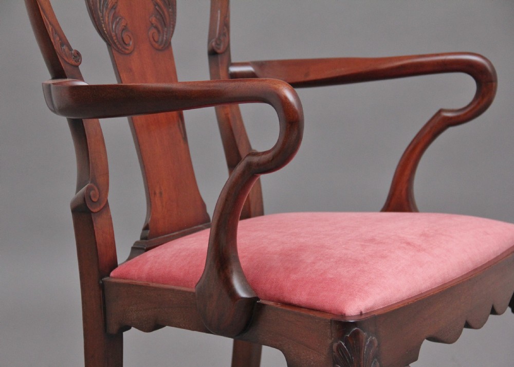 Set of eight 19th-century carved mahogany dining chairs featuring cabriole legs with ball and claw feet and red upholstered seats. View X