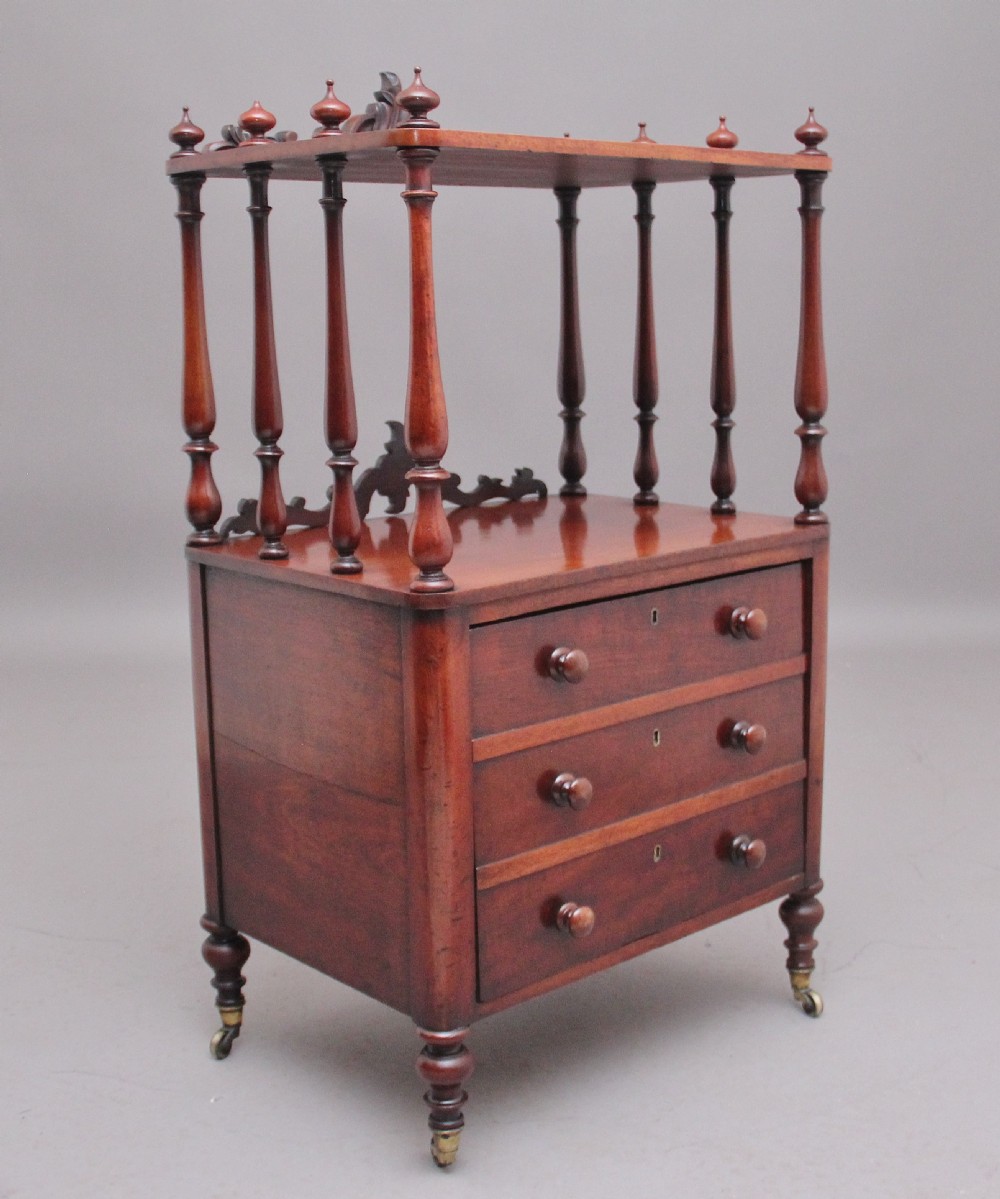 A 19th-century mahogany whatnot with open turned-spindle top shelf over three drawers raised on brass castors.