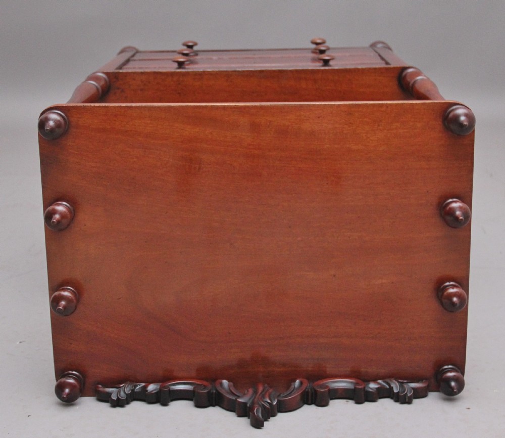 A 19th-century mahogany whatnot with open turned-spindle top shelf over three drawers raised on brass castors. View VIII