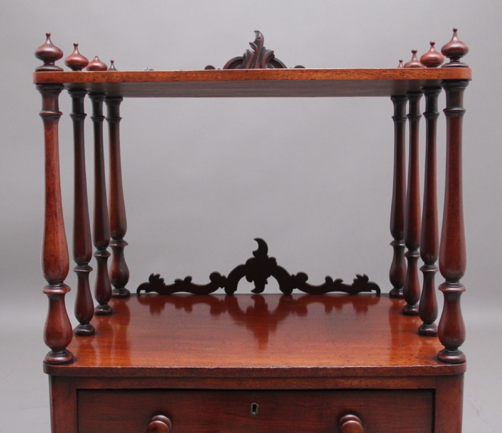 A 19th-century mahogany whatnot with open turned-spindle top shelf over three drawers raised on brass castors. View IX
