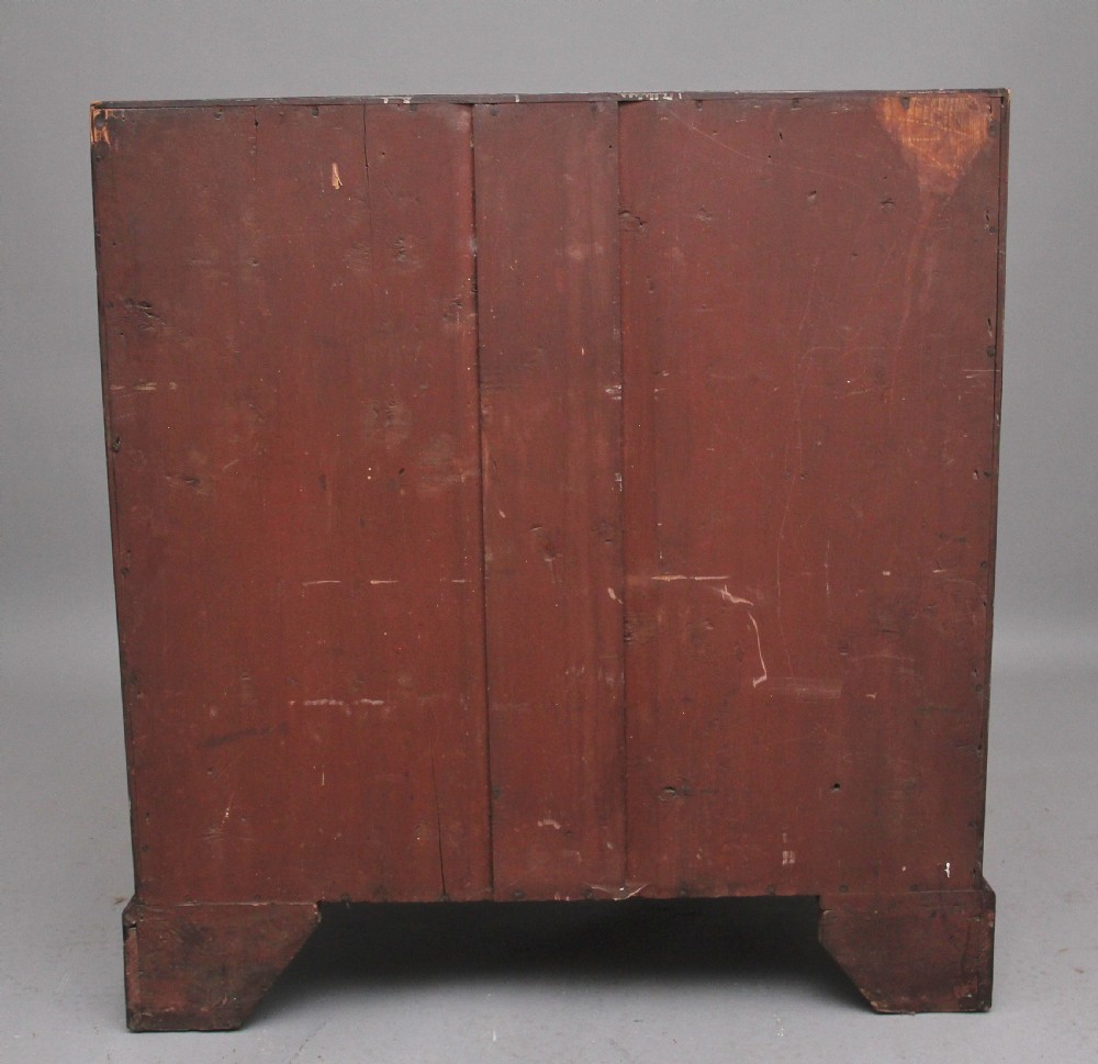 An eighteenth-century mahogany writing bureau featuring a slant-front slope above four graduated drawers with brass swan-neck handles and bracket feet. View III