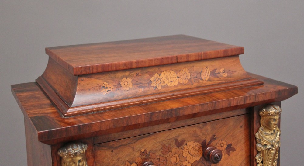A tall, narrow Victorian walnut Wellington chest featuring six drawers decorated with floral marquetry inlays and cast ormolu mounts. View VI