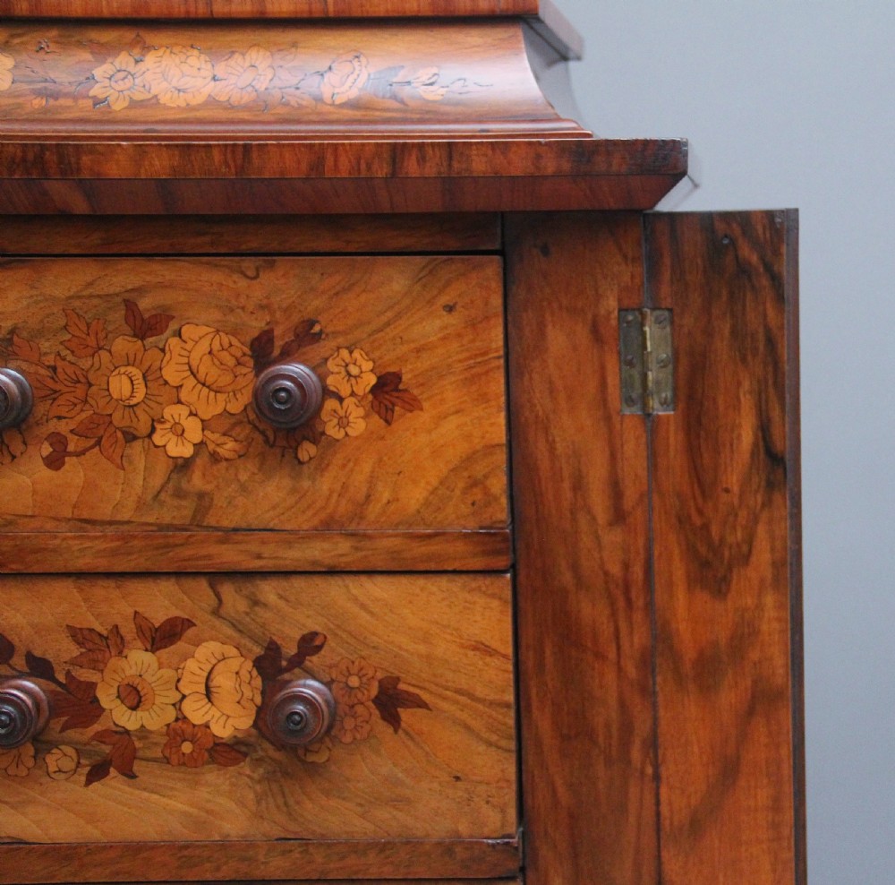 A tall, narrow Victorian walnut Wellington chest featuring six drawers decorated with floral marquetry inlays and cast ormolu mounts. View XI