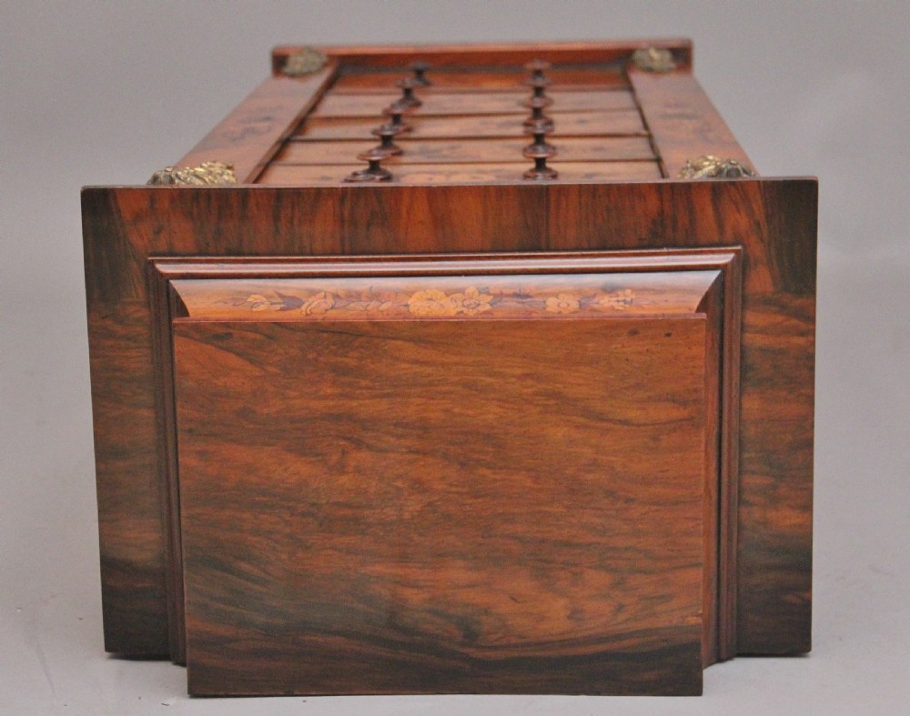 A tall, narrow Victorian walnut Wellington chest featuring six drawers decorated with floral marquetry inlays and cast ormolu mounts. View XIII