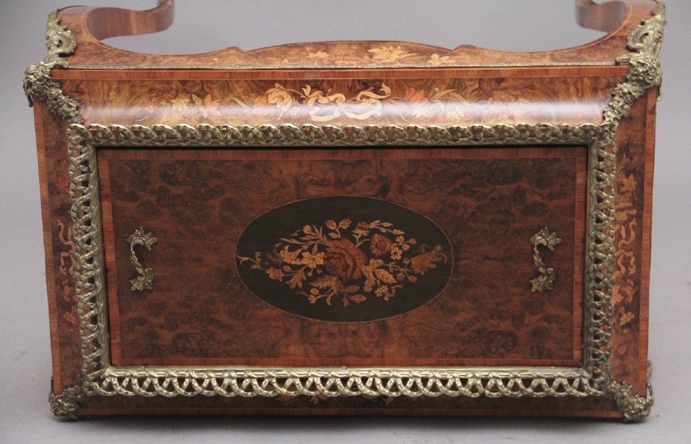A 19th-century French Louis XV style burr walnut jardiniere table with floral marquetry inlay, brass gallery top, and gilt bronze mounts on cabriole legs. View VI