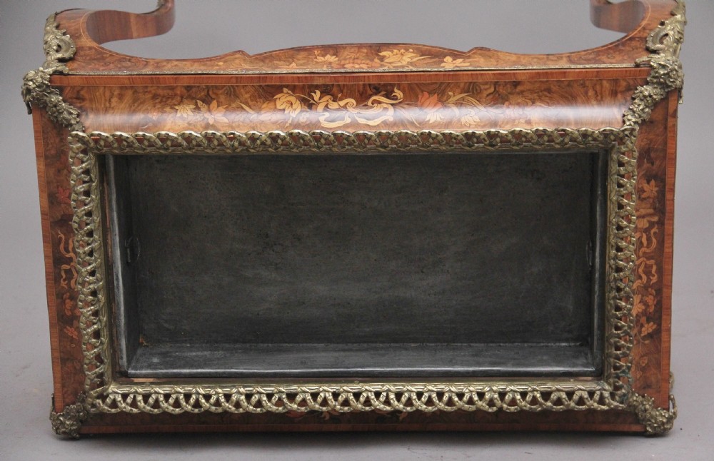 A 19th-century French Louis XV style burr walnut jardiniere table with floral marquetry inlay, brass gallery top, and gilt bronze mounts on cabriole legs. View VII