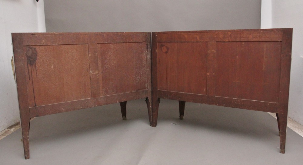 A matching pair of 19th-century French kingwood commodes featuring herringbone parquetry veneer, gilt bronze mounts, and fitted marble tops. View VI