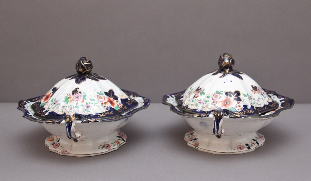 A pair of 19th-century white and cobalt blue ironstone tureens featuring hand-painted floral decoration, gilt accents, moulded handles, and flower bud finials. View III