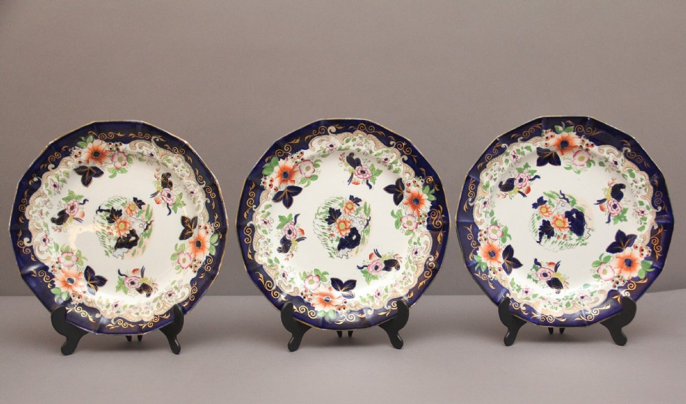 A set of six octagonal 19th-century Masons ironstone plates featuring cobalt blue borders, orange and pink floral transfer motifs, and gilt highlights. View VI