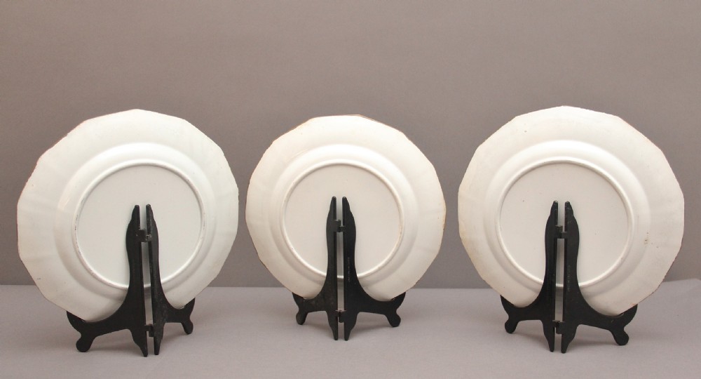 A set of six octagonal 19th-century Masons ironstone plates featuring cobalt blue borders, orange and pink floral transfer motifs, and gilt highlights. View VIII