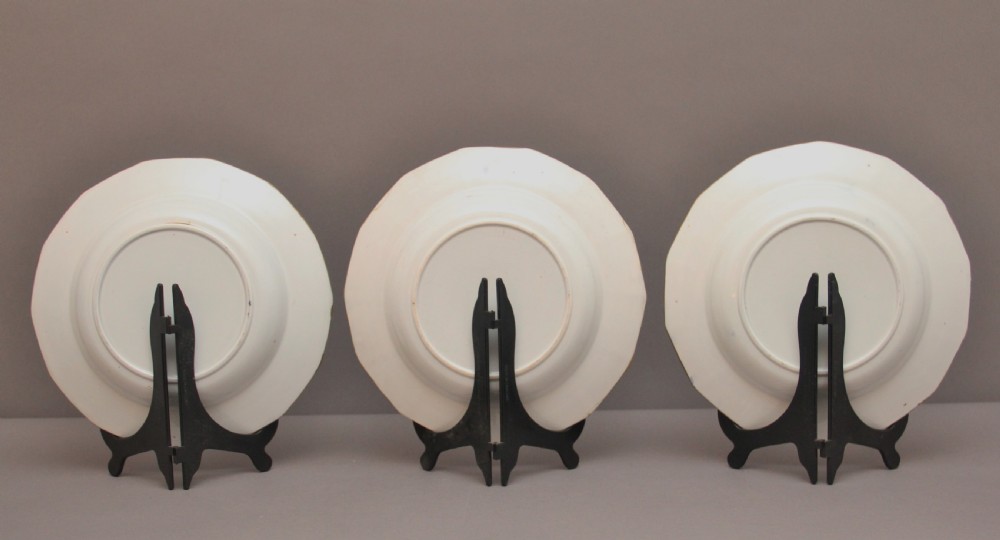 A set of six octagonal 19th-century Masons ironstone soup bowls featuring dark blue borders with gold scrollwork and hand-painted floral motifs. View VIII