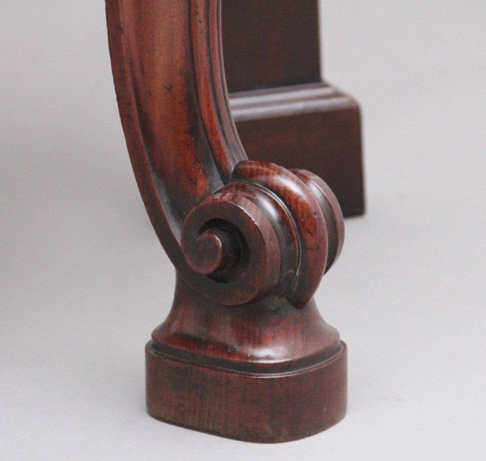 A 19th-century mahogany serving table featuring a carved back gallery, curved cabriole legs, and a lower tier shelf. View IX
