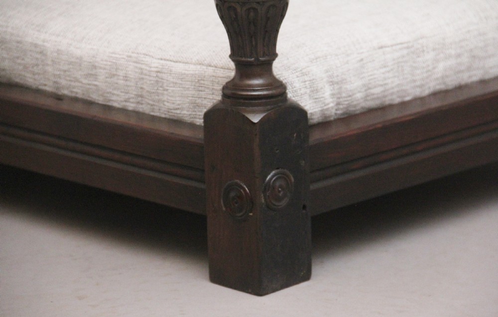A nineteenth-century mahogany four-poster dog bed featuring carved reeded posts, a moulded canopy frame, and a neutral fabric cushion. View IX