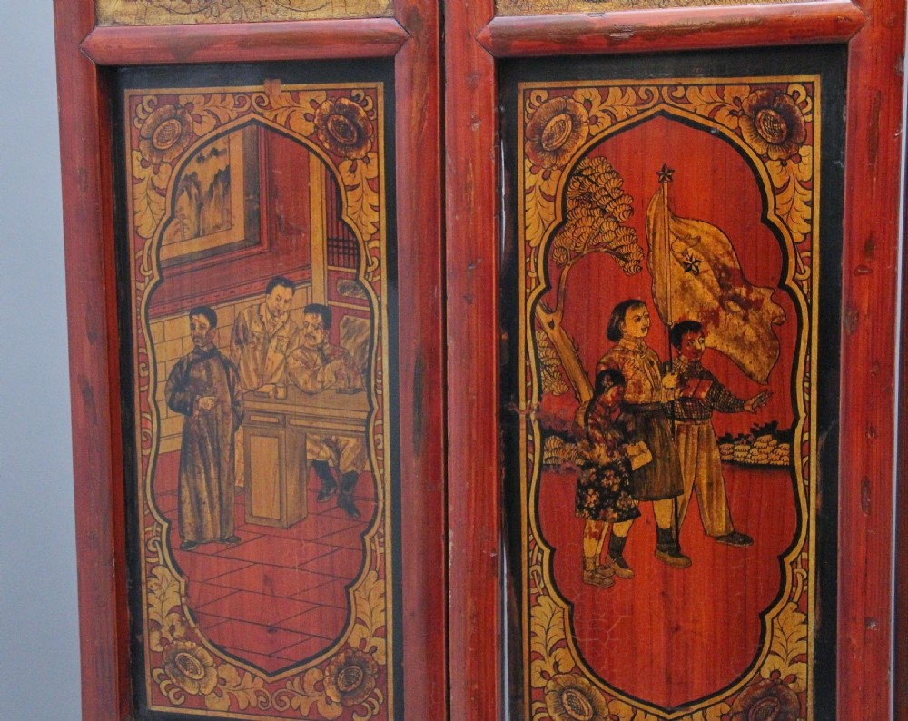 An early 20th-century seven-panel Chinese folding screen featuring crimson and black lacquered sections decorated with hand-painted figures and gilded floral borders. View VIII