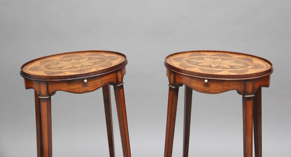 A pair of tall, oval-topped mahogany urn stands featuring central floral marquetry inlays, pull-out slides, square tapered legs, and curved X-form stretchers. View III