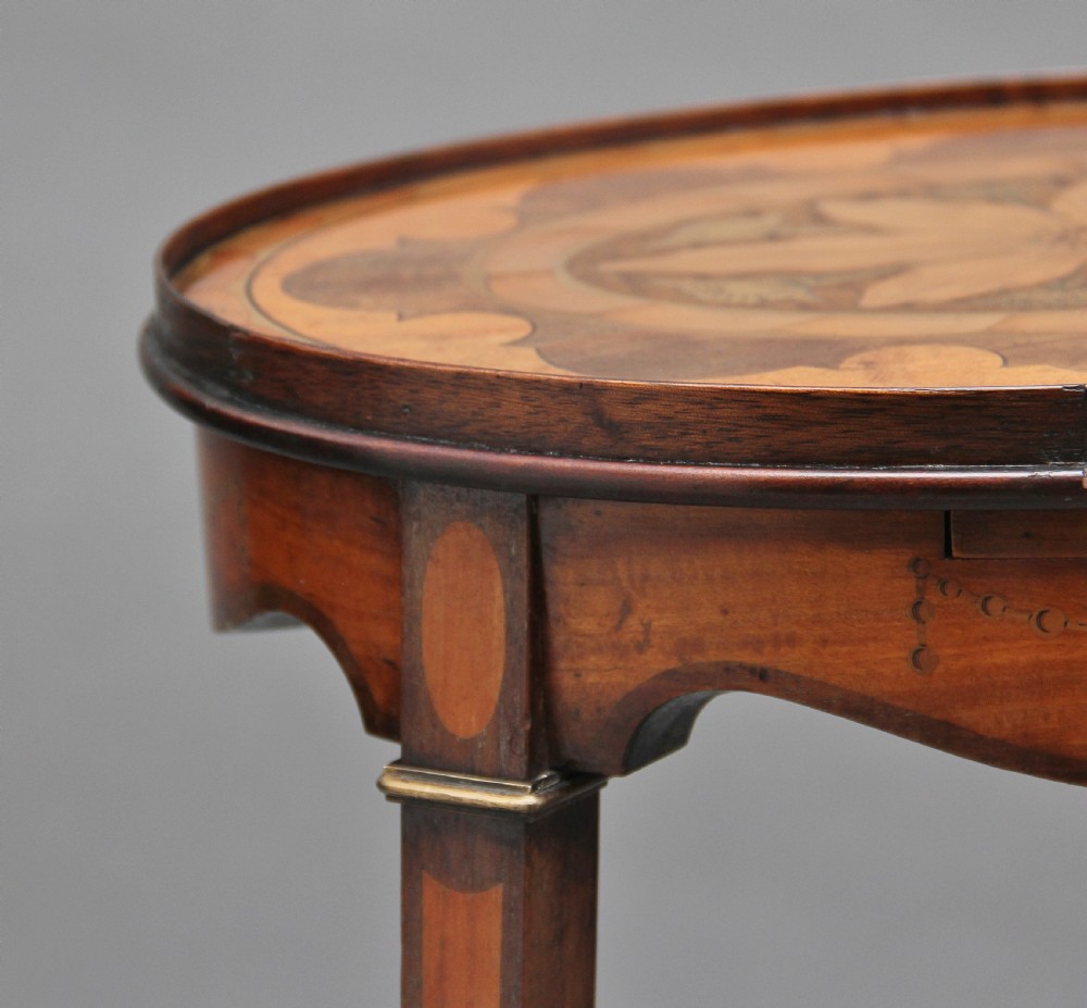A pair of tall, oval-topped mahogany urn stands featuring central floral marquetry inlays, pull-out slides, square tapered legs, and curved X-form stretchers. View XII