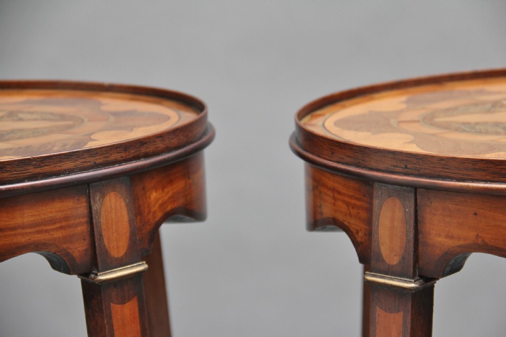 A pair of tall, oval-topped mahogany urn stands featuring central floral marquetry inlays, pull-out slides, square tapered legs, and curved X-form stretchers. View XIV