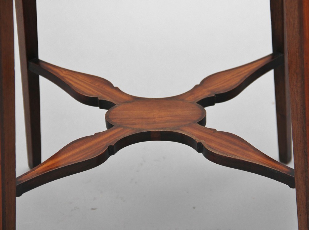 A pair of tall, oval-topped mahogany urn stands featuring central floral marquetry inlays, pull-out slides, square tapered legs, and curved X-form stretchers. View XV