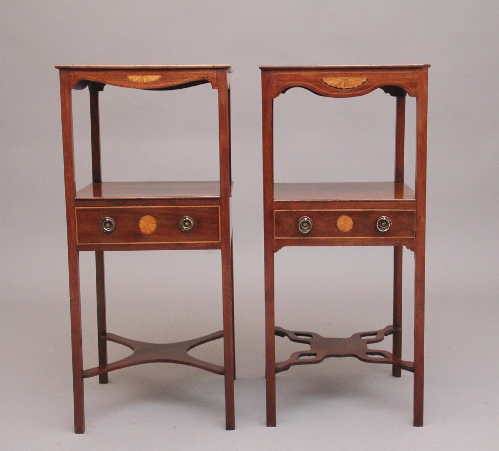 A near pair of tall 19th-century mahogany bedside tables featuring fan marquetry inlay, single drawers with brass ring handles, open upper shelves, and decorative cross-stretchers. View III