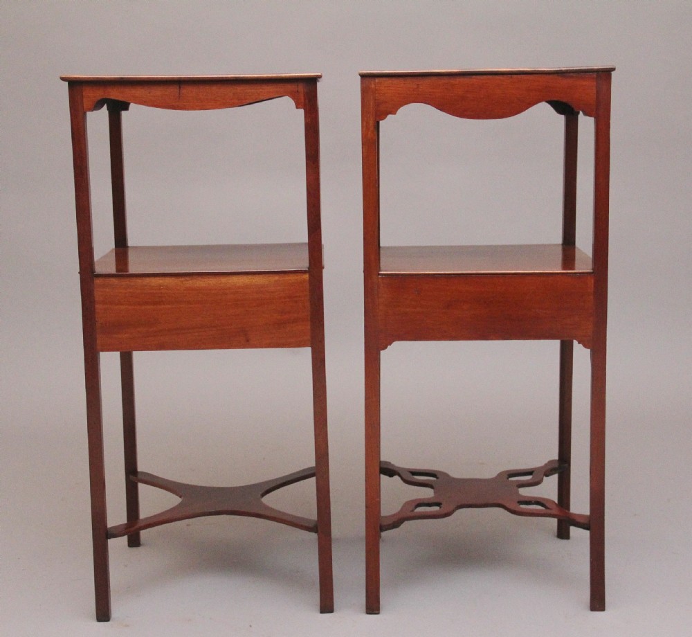 A near pair of tall 19th-century mahogany bedside tables featuring fan marquetry inlay, single drawers with brass ring handles, open upper shelves, and decorative cross-stretchers. View VI