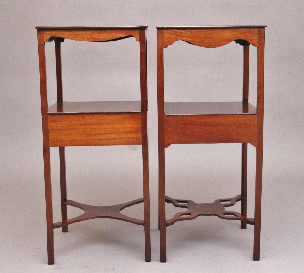 A near pair of tall 19th-century mahogany bedside tables featuring fan marquetry inlay, single drawers with brass ring handles, open upper shelves, and decorative cross-stretchers. View VII