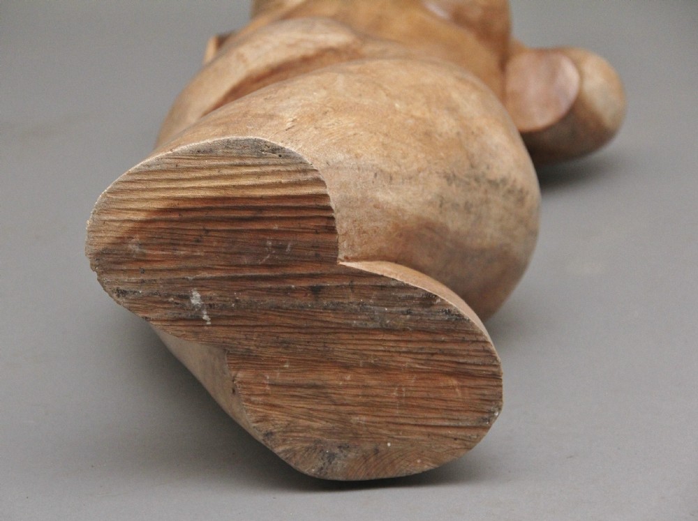 A life-size carved wooden female torso sculpture displayed against a neutral grey background. View XVIII