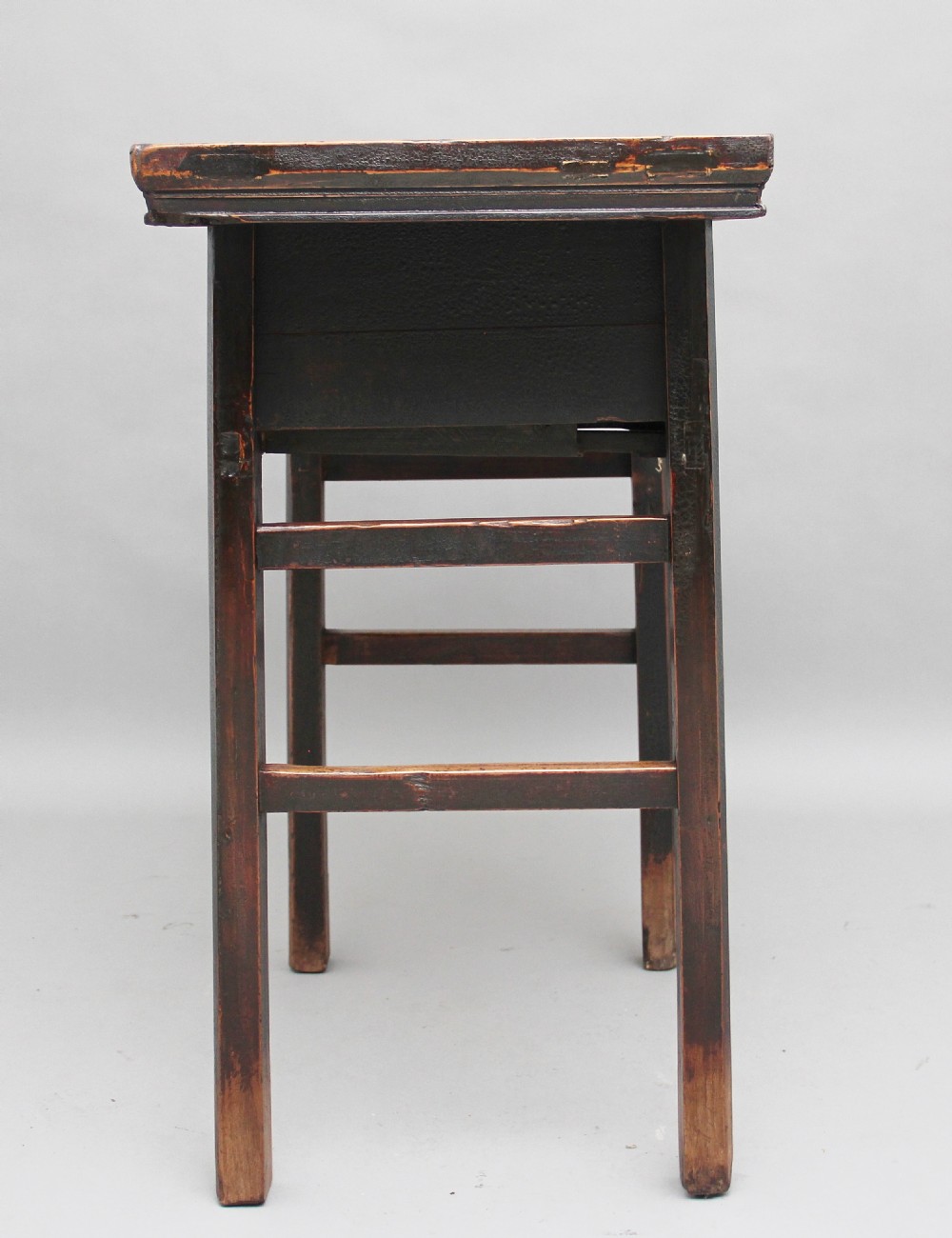 A nineteenth-century dark brown Chinese elm side table featuring a single drawer with a metal ring pull and straight square legs. View V