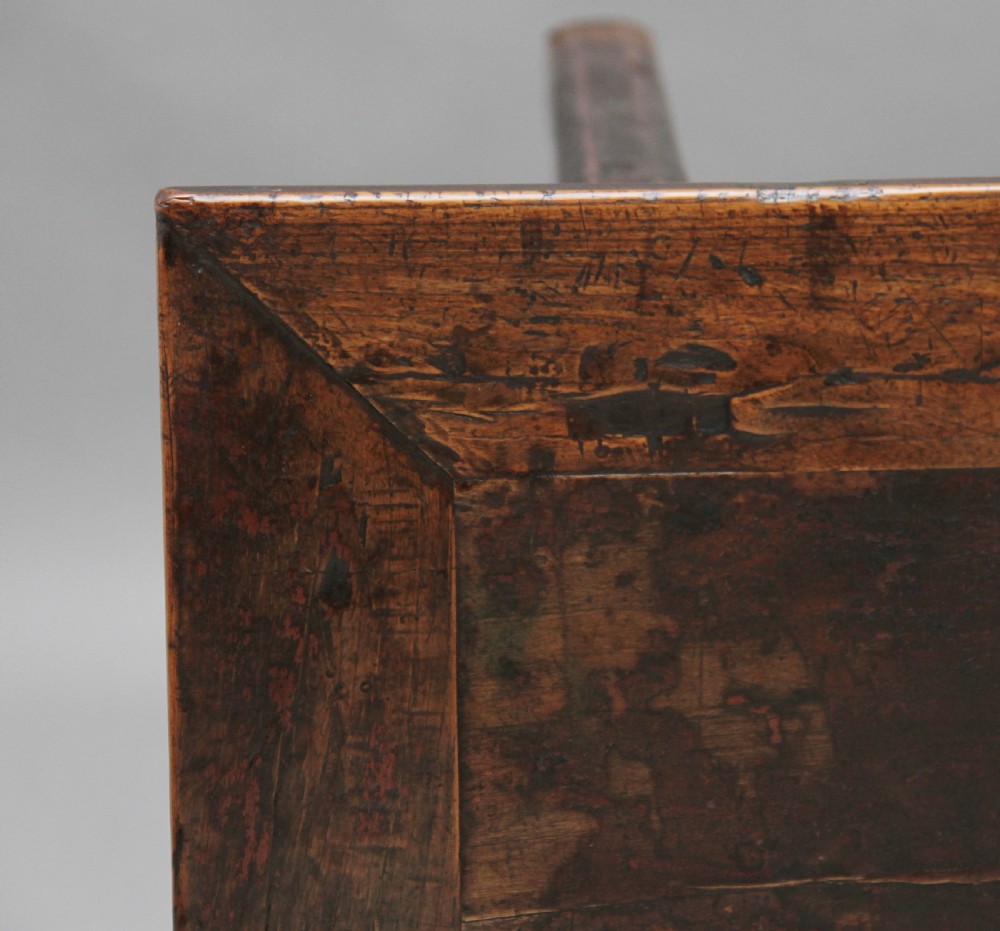 A nineteenth-century dark brown Chinese elm side table featuring a single drawer with a metal ring pull and straight square legs. View VII