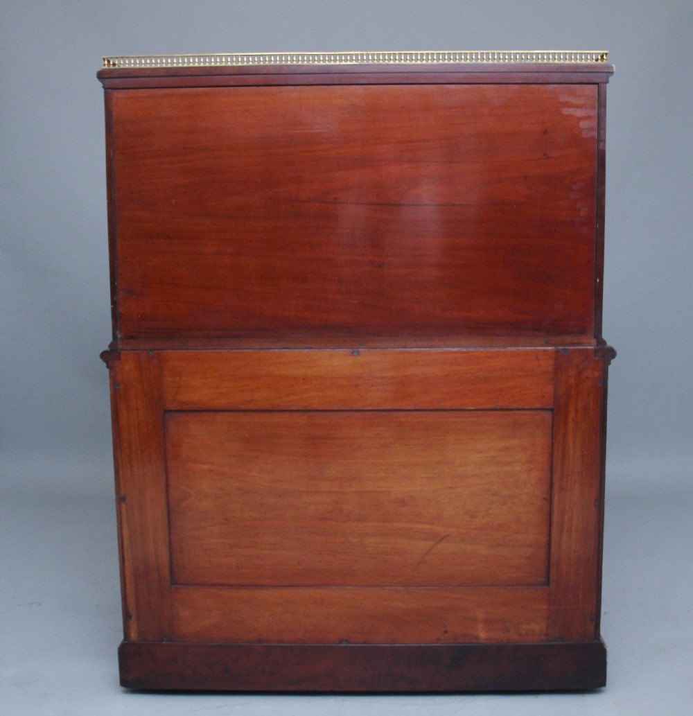 A 19th-century mahogany secretaire desk with open upper cabinet doors, fitted internal pigeonholes, and an extended pull-out writing surface lined in green leather. View IV
