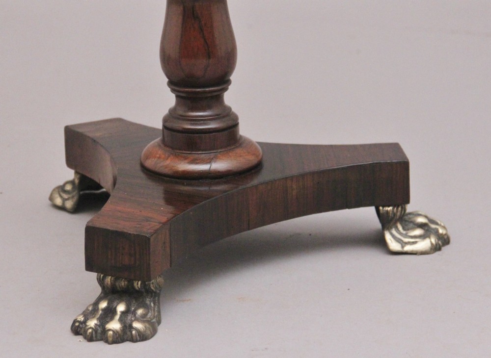 A 19th-century dark rosewood telescopic occasional table with a circular top featuring a brass gallery rim, a turned pedestal column, and a triform base on brass claw feet. View VII
