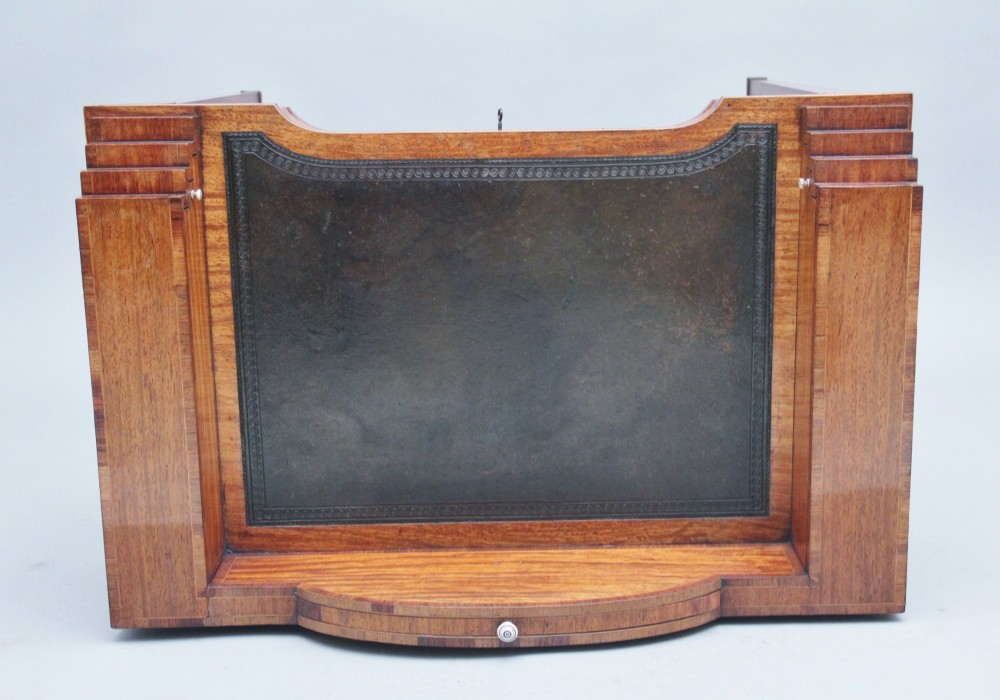 A 19th-century satinwood ladies writing table featuring a stepped side gallery, single frieze drawer, tapered square legs on brass castors, and a lower undertier. View III