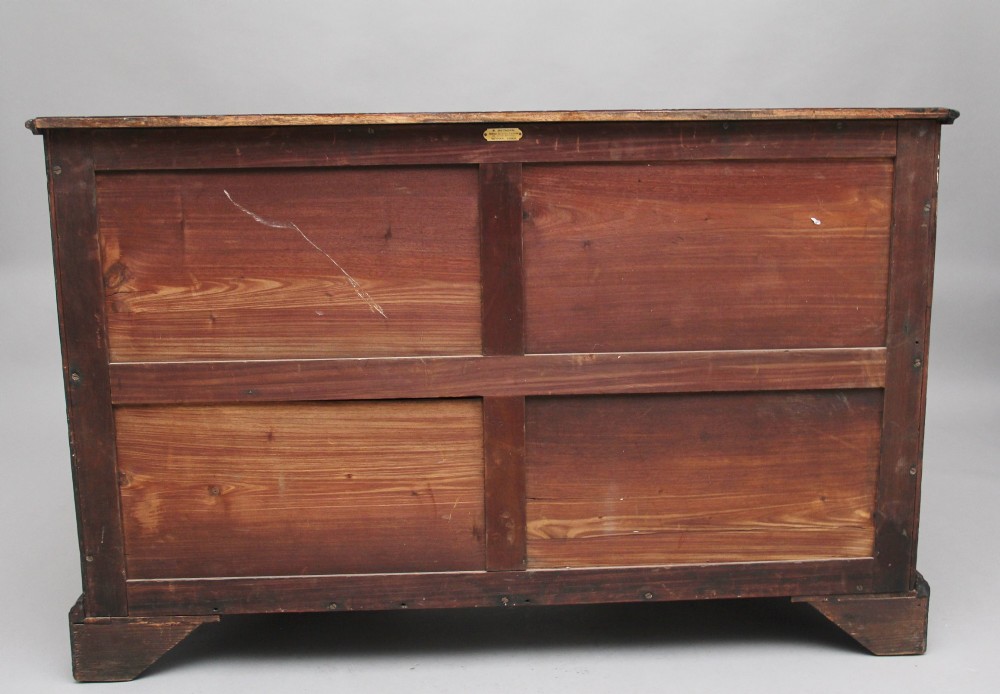 An 18th-century mahogany kneehole desk featuring a central recessed cupboard, multiple drawers with brass swan-neck handles, and bracket feet. View VIII