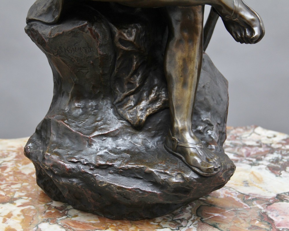 A 19th-century patinated bronze sculpture depicting the mythological figure Oedipus seated on a rock in contemplation while holding a staff. View XIV