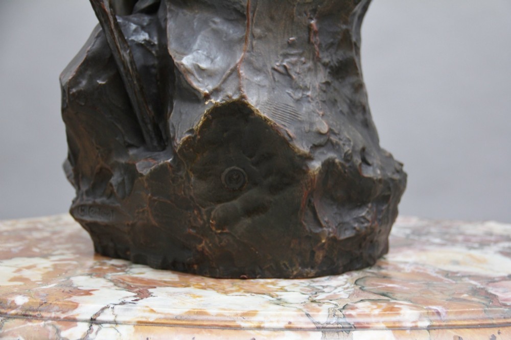 A 19th-century patinated bronze sculpture depicting the mythological figure Oedipus seated on a rock in contemplation while holding a staff. View XV