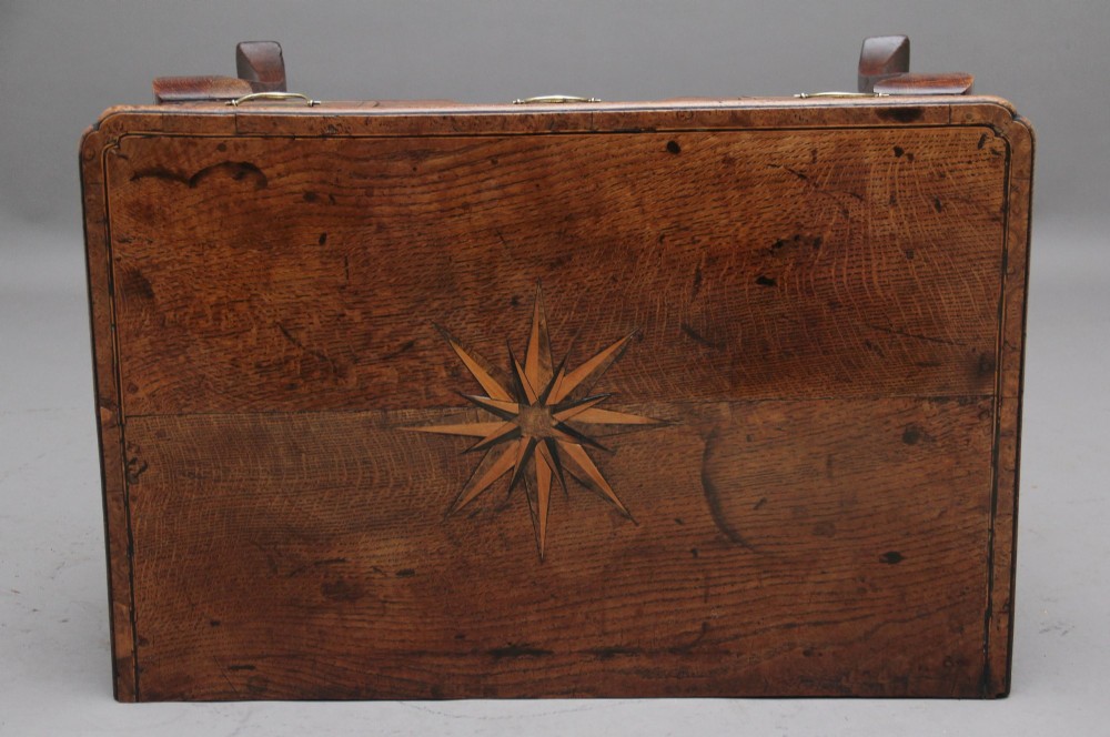 An 18th-century oak lowboy table featuring three drawers with brass handles, inlaid chevron borders, a scalloped apron, and four cabriole legs. View VIII