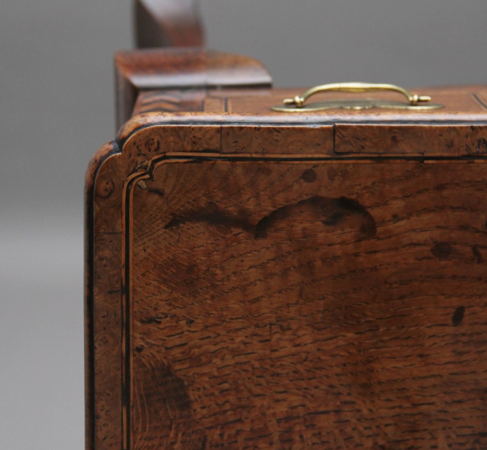 An 18th-century oak lowboy table featuring three drawers with brass handles, inlaid chevron borders, a scalloped apron, and four cabriole legs. View IX