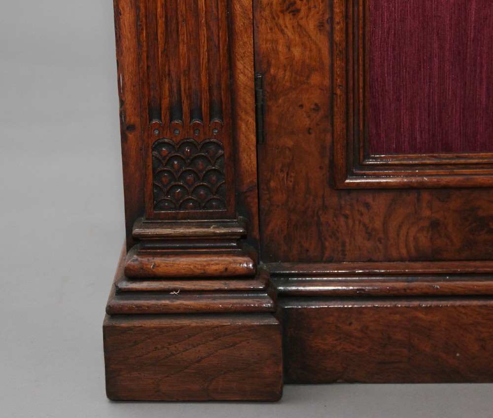 A nineteenth-century pollard oak cabinet featuring a mirrored gallery top, fluted column pillars, and twin doors with fabric-lined panels. View XII
