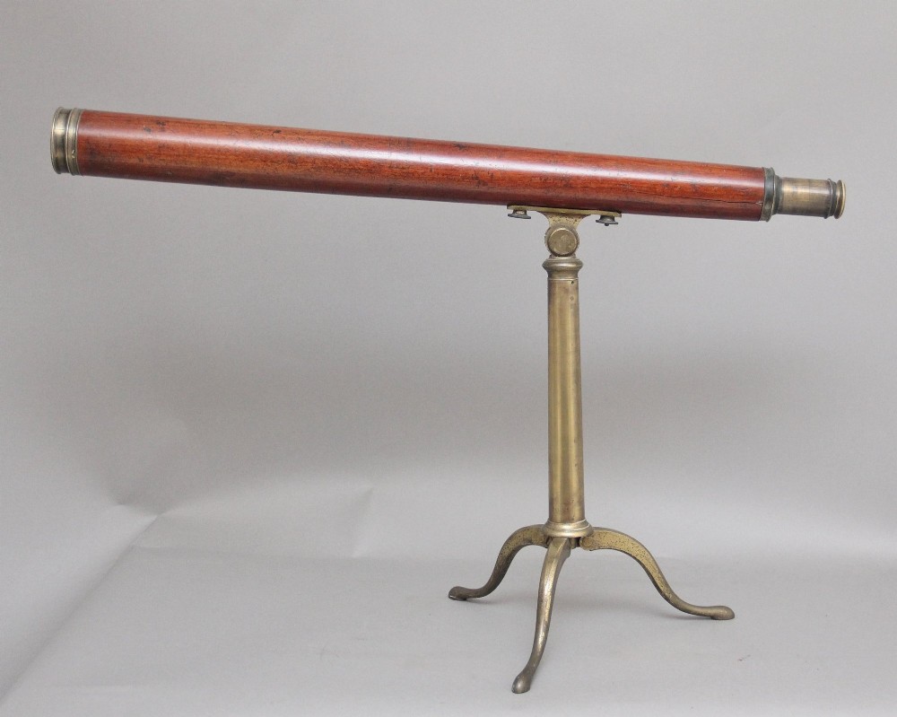 An 18th-century mahogany barrel telescope mounted on an adjustable brass column with a folding tripod base. View V