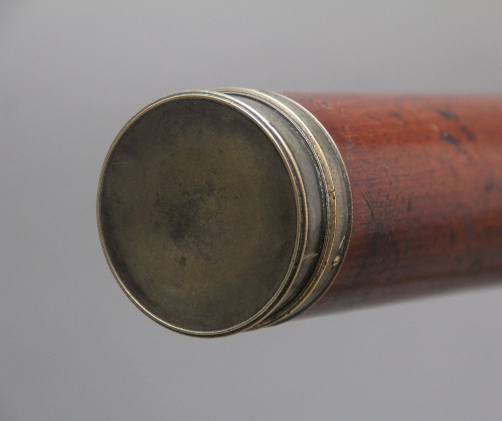 An 18th-century mahogany barrel telescope mounted on an adjustable brass column with a folding tripod base. View XII