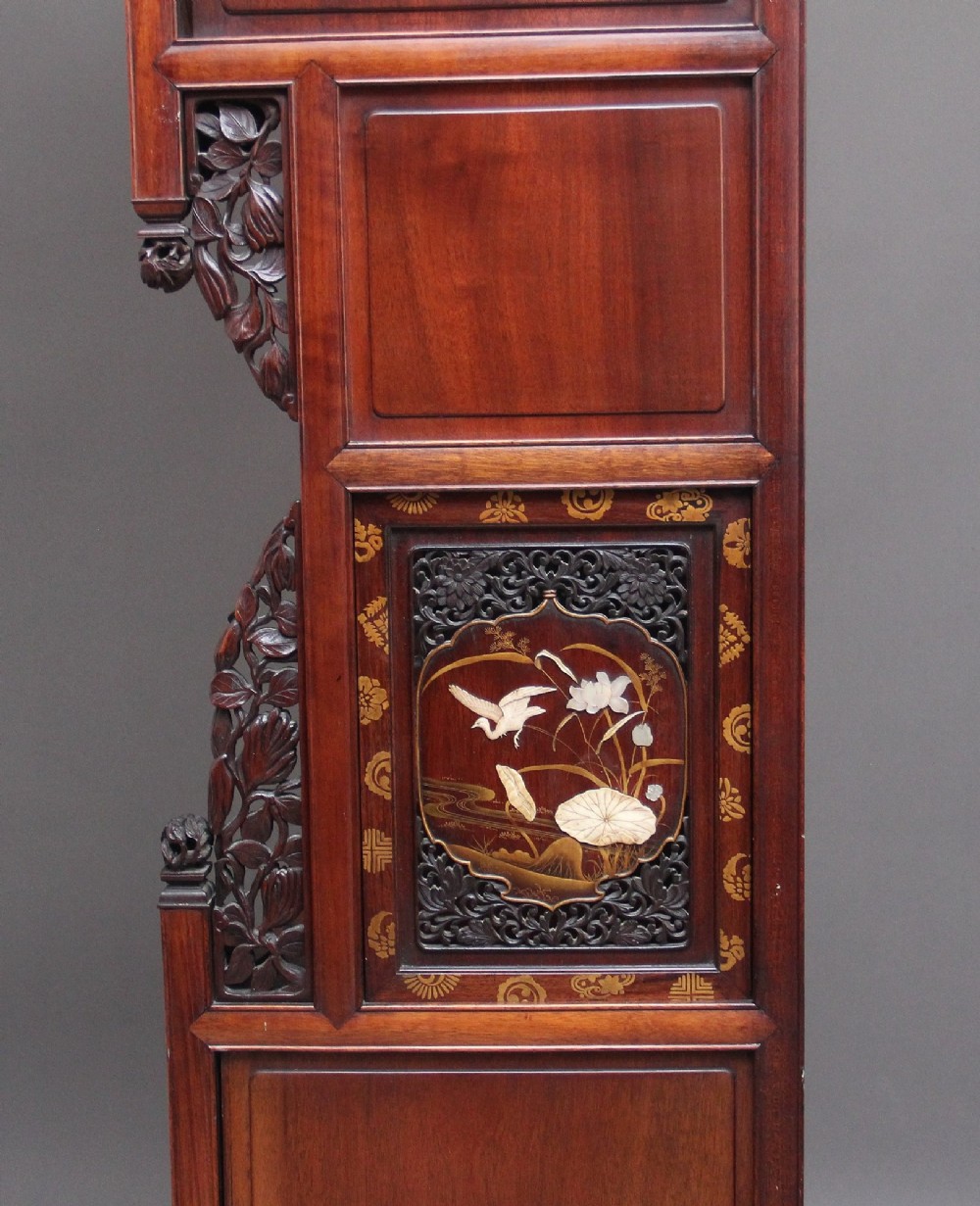 A large 19th-century Japanese hardwood Shodona cabinet featuring asymmetric shelves, carved dragon cresting, and panel doors adorned with lacquer and mother-of-pearl bird motifs. View VIII