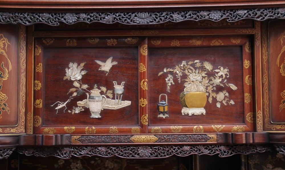 A large 19th-century Japanese hardwood Shodona cabinet featuring asymmetric shelves, carved dragon cresting, and panel doors adorned with lacquer and mother-of-pearl bird motifs. View XI