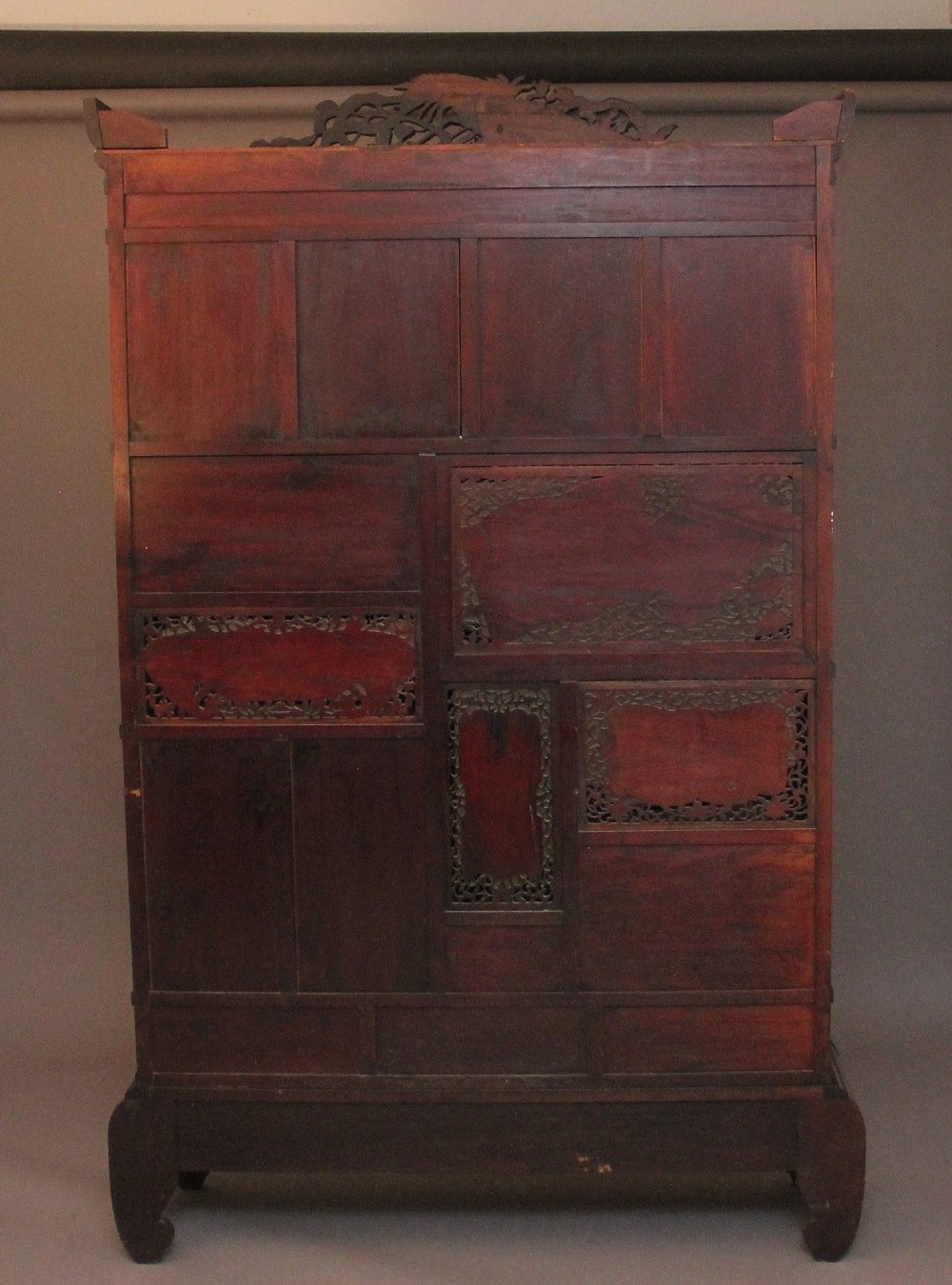 A 19th-century Japanese Meiji period shodona display cabinet with asymmetrical lacquered doors, bird and floral shibayama inlays, and carved cresting. View VI