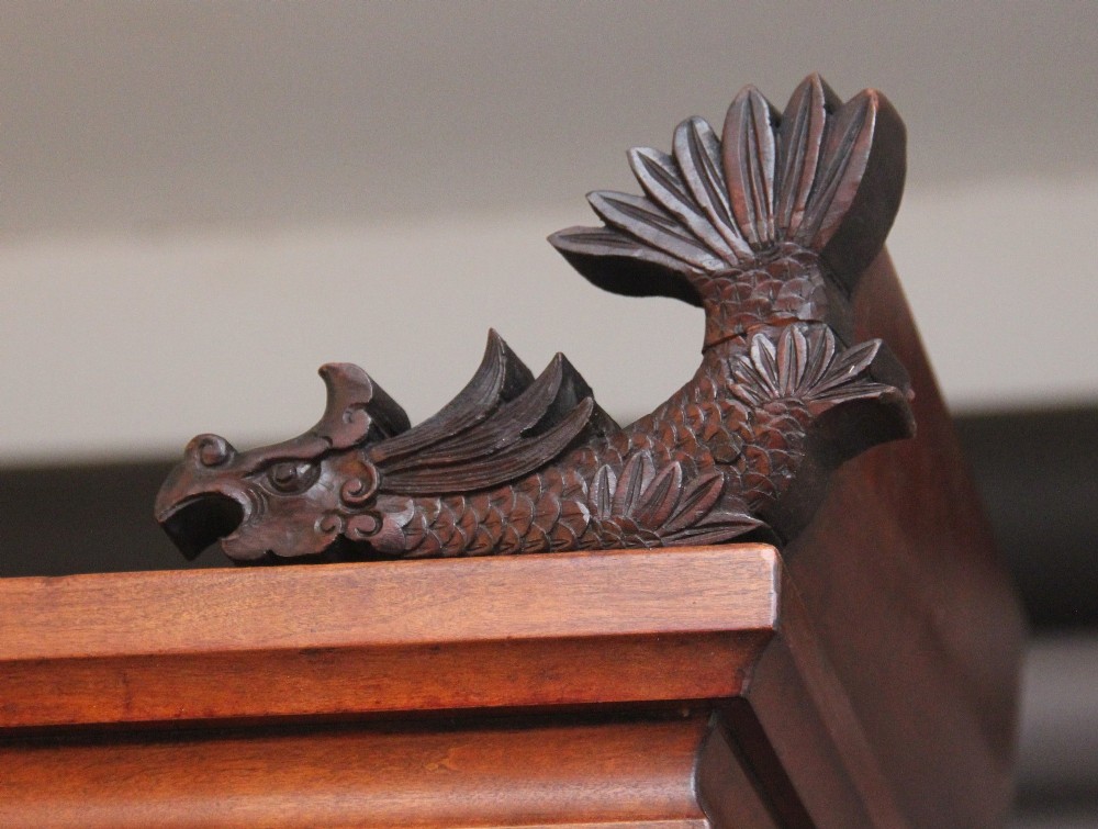 A 19th-century Japanese Meiji period shodona display cabinet with asymmetrical lacquered doors, bird and floral shibayama inlays, and carved cresting. View XIV